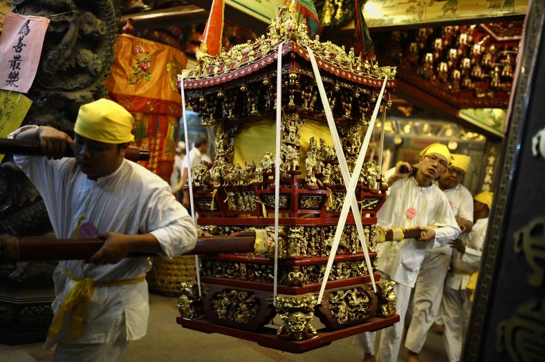 Malaysian Chinese devotees carry a statue during the last day of Nine Emperor Gods Festival at Nine Emperor Gods temple outside Kuala Lumpur on October 02, 2014. The nine-day Taoist festival, believers welcome the “emperor gods” who they believe live amongst the stars, in order to bring good fortune, longevity and good health. Some devotees stay at a temple during the festival, which begins on the eve of the ninth lunar month of the Chinese calendar, where they consume vegetarian meals and recite continuous prayers. Photo Adib Rawi Yahya