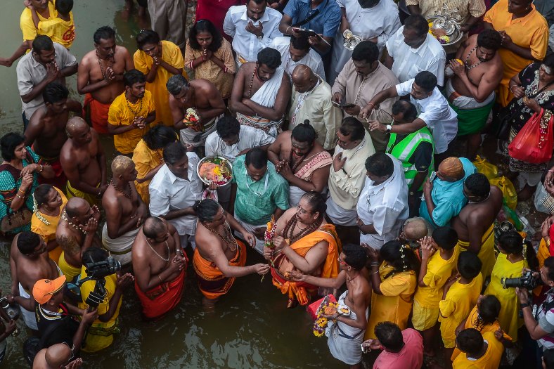Malaysian Hindu devotees perform their religious rites during the Thaipusam festival at Batu Caves outskirts of Kuala Lumpur on February 03, 2015. The Hindu festival of Thaipusam, which commemorates the day when Goddess Pavarthi gave her son Lord Muruga an invincible lance with which he destroyed evil demons, is celebrated by some two million ethnic Indians in Malaysia and Singapore. photo Adib Rawi Yahya